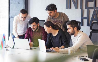 colleagues-working-project-discussing-details-web